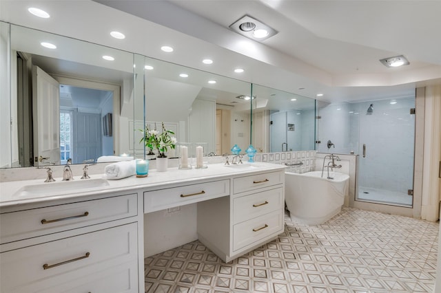 3400 Shenandoah St, University Park, TX 75205 - bathroom featuring a sink, double vanity, a stall shower, and a freestanding tub