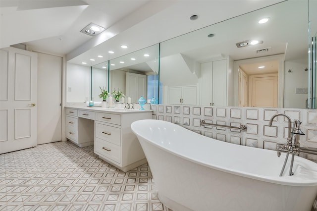 3400 Shenandoah St, University Park, TX 75205 - full bath featuring vanity, visible vents, a freestanding tub, and recessed lighting