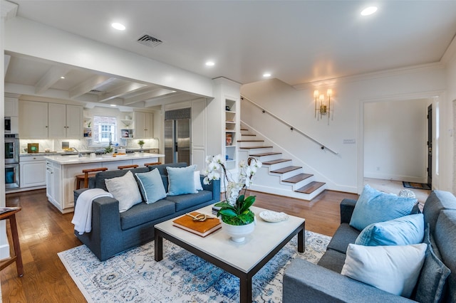 3400 Shenandoah St, University Park, TX 75205 - living area featuring stairs, dark wood-style floors, visible vents, and beam ceiling