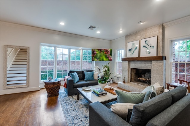 3400 Shenandoah St, University Park, TX 75205 - living area with wood finished floors, ornamental molding, visible vents, a fireplace, and baseboards