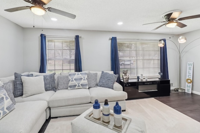 5636 Everglade Rd, Dallas, TX 75227 - living room with a textured ceiling, ceiling fan, recessed lighting, and wood finished floors