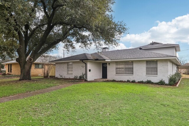 5636 Everglade Rd, Dallas, TX 75227 - ranch-style home with brick siding, a shingled roof, a front lawn, and a chimney