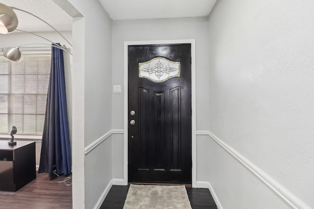 5636 Everglade Rd, Dallas, TX 75227 - foyer entrance featuring baseboards and wood finished floors