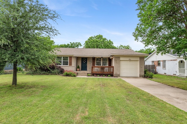 single story home featuring a garage, a front lawn, fence, concrete driveway, and a porch