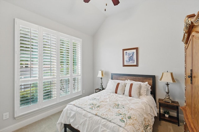 carpeted bedroom with baseboards, ceiling fan, and lofted ceiling
