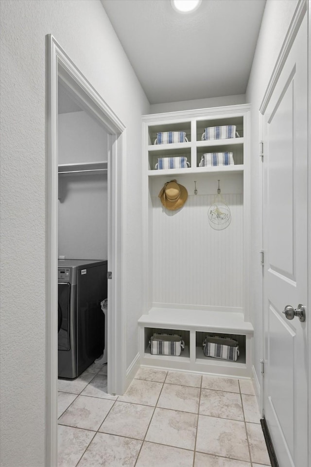 mudroom featuring tile patterned flooring and washer / dryer