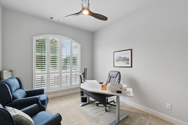 office area with ceiling fan, visible vents, baseboards, and carpet