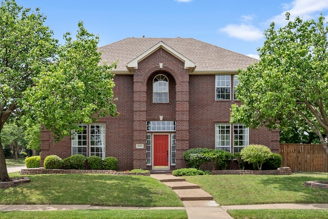 6401 Marlar Ln, The Colony, TX 75056 - view of front of home featuring brick siding and roof with shingles