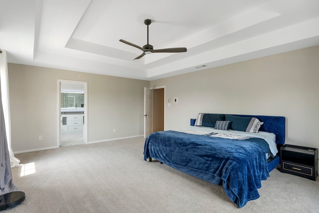 6401 Marlar Ln, The Colony, TX 75056 - bedroom featuring a raised ceiling, carpet floors, baseboards, and ensuite bath