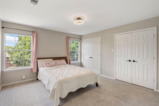 6401 Marlar Ln, The Colony, TX 75056 - carpeted bedroom with multiple closets and baseboards