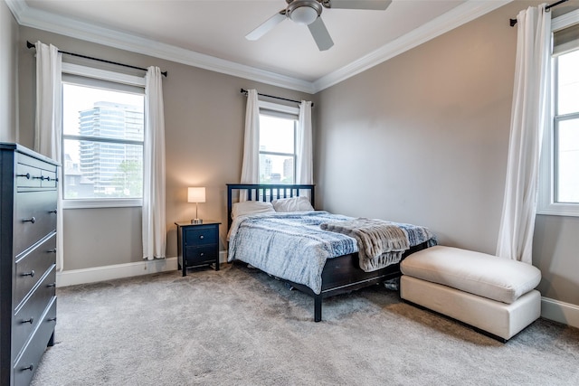bedroom with crown molding, a ceiling fan, carpet, and baseboards