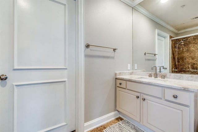 full bath with crown molding, a tile shower, vanity, baseboards, and tile patterned floors