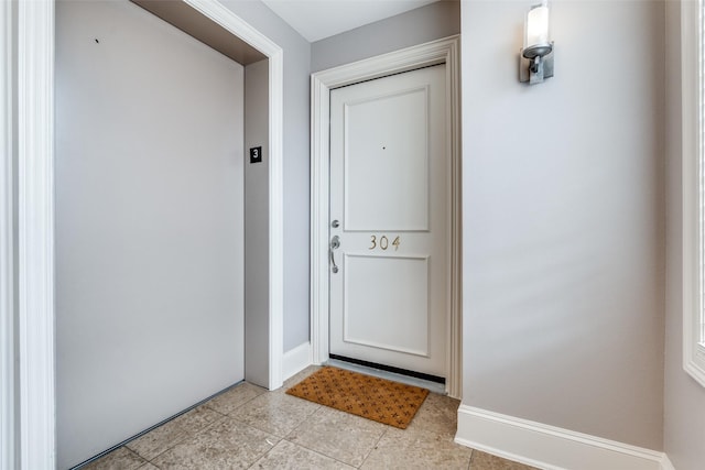entrance to property featuring elevator