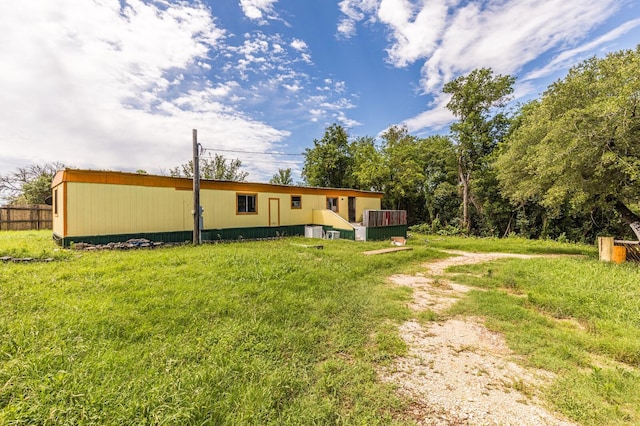 view of yard with fence and a deck
