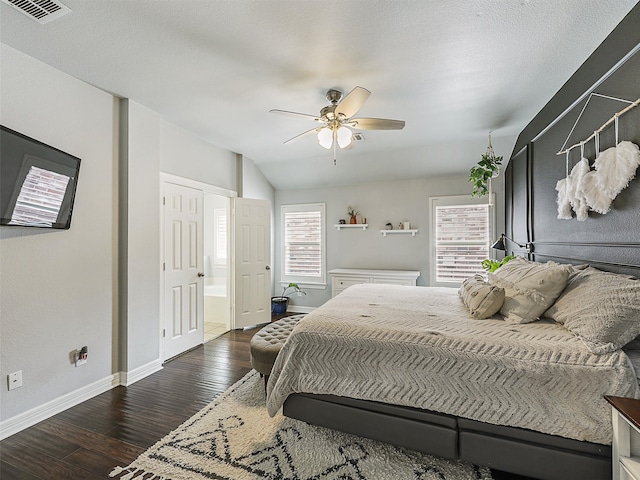bedroom featuring visible vents, wood finished floors, lofted ceiling, baseboards, and ceiling fan