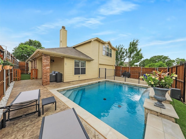 view of pool featuring a patio, a fenced backyard, and a fenced in pool