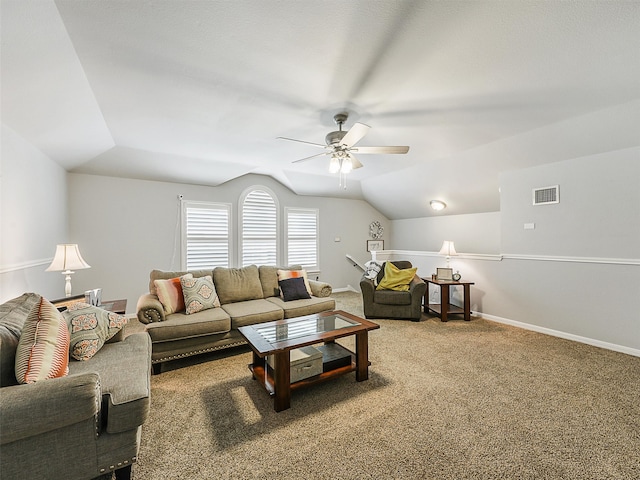 living area with visible vents, carpet floors, lofted ceiling, baseboards, and a ceiling fan