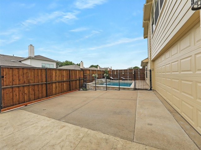 view of patio / terrace with a fenced backyard and a fenced in pool