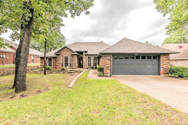 ranch-style house featuring brick siding, driveway, roof with shingles, and a garage