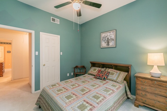 carpeted bedroom featuring a ceiling fan, baseboards, and visible vents