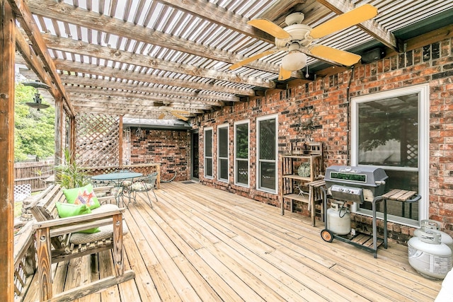 deck with area for grilling, a pergola, a ceiling fan, and outdoor dining area