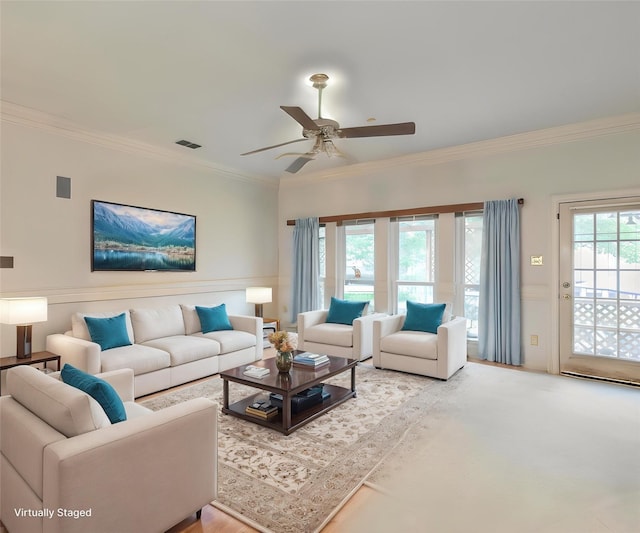 7917 Kendra Ln, North Richland Hills, TX 76182 - living room featuring ornamental molding, a ceiling fan, and a wainscoted wall
