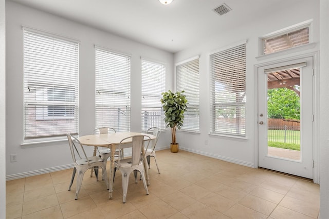 dining space featuring visible vents, baseboards, and light tile patterned flooring