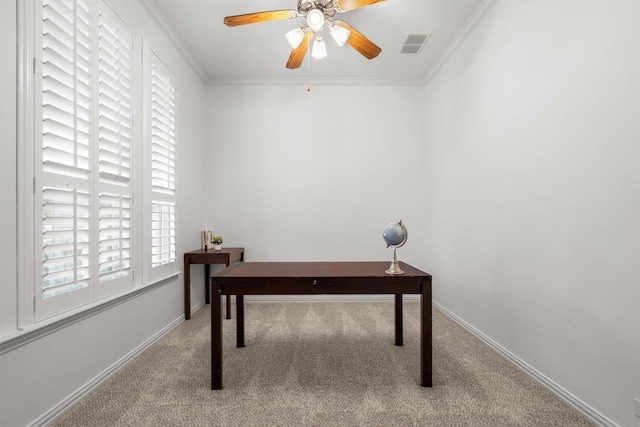 unfurnished office featuring visible vents, crown molding, and carpet floors