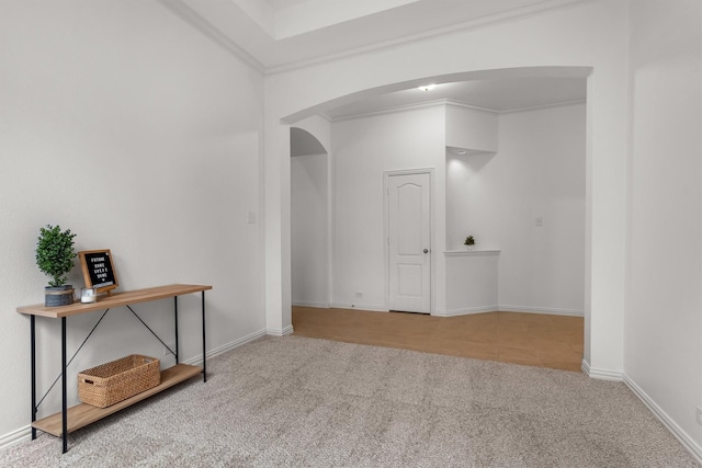 1390 Bonham Pkwy, Lantana, TX 76226 - spare room with arched walkways, carpet floors, crown molding, and baseboards