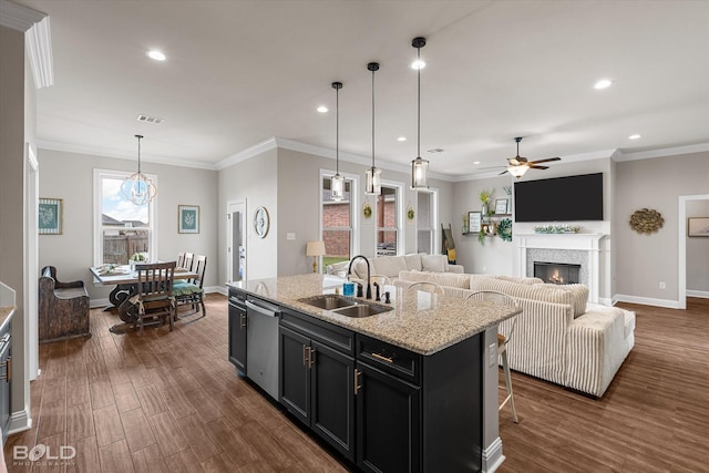 kitchen featuring recessed lighting, a sink, and dark wood finished floors