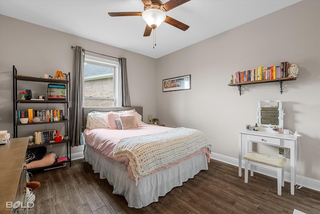 bedroom with baseboards, a ceiling fan, and dark wood-style flooring