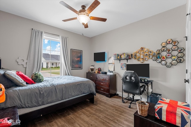 bedroom with a ceiling fan and wood finished floors