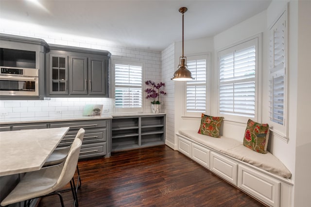 dining area with dark wood-type flooring