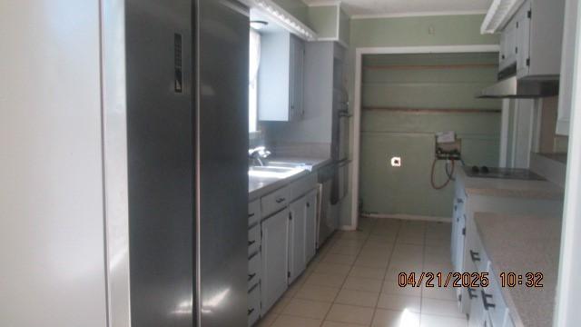 bathroom with a sink and tile patterned floors