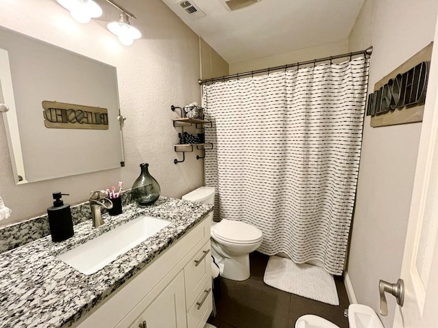 bathroom with visible vents, tile patterned flooring, vanity, toilet, and a shower with shower curtain
