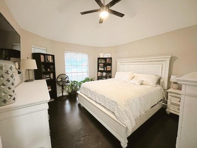 bedroom featuring ceiling fan and dark wood finished floors