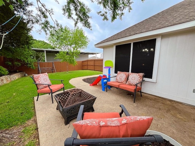 view of patio / terrace featuring a fenced backyard and a fire pit