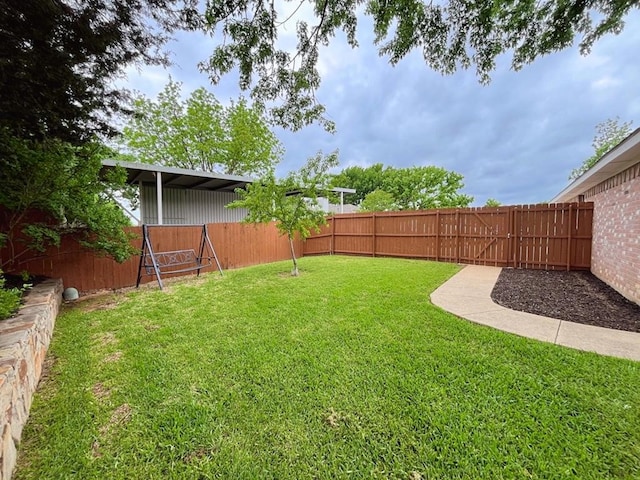 view of yard with a fenced backyard
