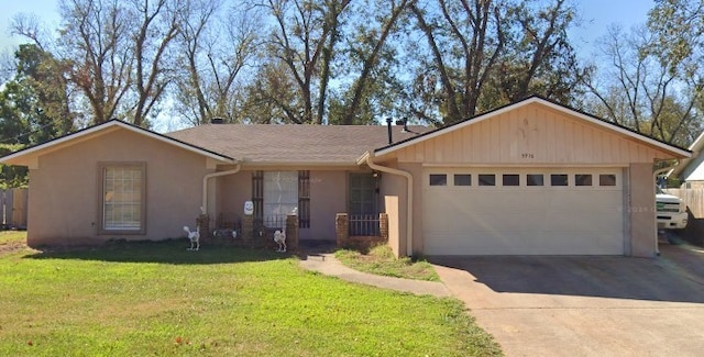 ranch-style home featuring a garage, stucco siding, concrete driveway, and a front yard