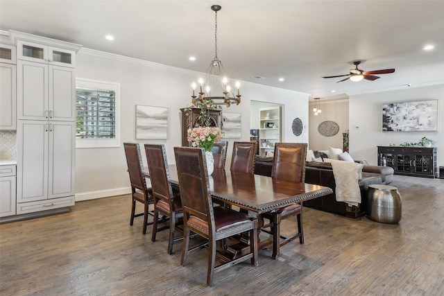 dining area with crown molding, recessed lighting, and dark wood-type flooring