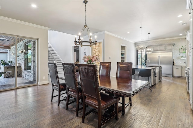 dining room featuring stairs, wood finished floors, baseboards, recessed lighting, and a notable chandelier