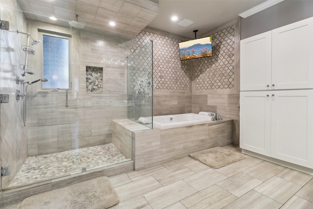 full bath featuring a bath, crown molding, tile walls, a shower stall, and recessed lighting