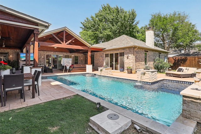 view of pool with outdoor lounge area, a fenced in pool, a patio area, an outdoor structure, and an exterior structure