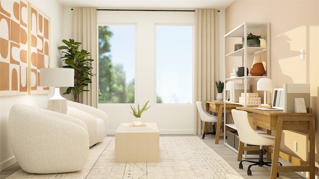 sitting room featuring baseboards and light wood-type flooring