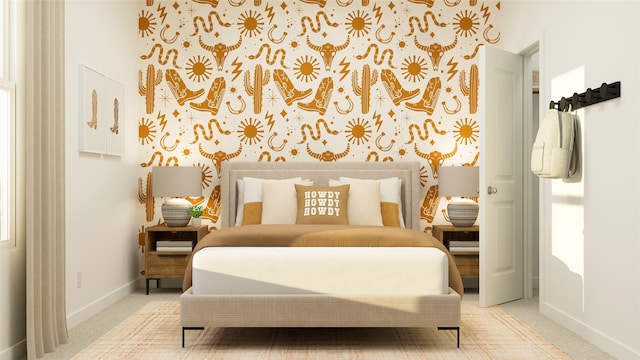 bedroom with baseboards and carpet