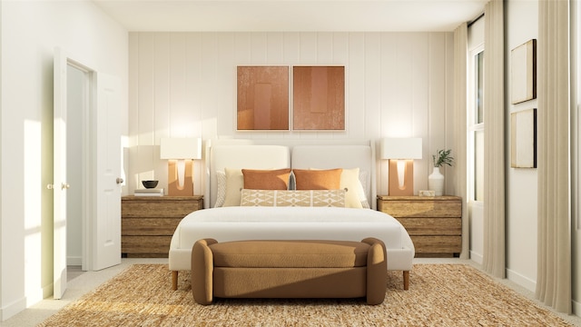 bedroom featuring baseboards and light colored carpet