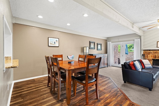 dining area featuring a textured ceiling, a ceiling fan, recessed lighting, baseboards, and dark wood-style floors