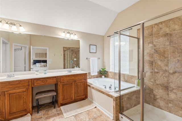 ensuite bathroom featuring double vanity, lofted ceiling, a bath, a sink, and a stall shower