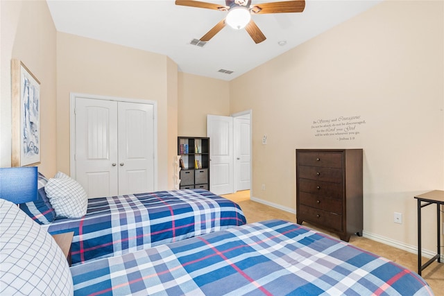 bedroom with visible vents, baseboards, and light carpet