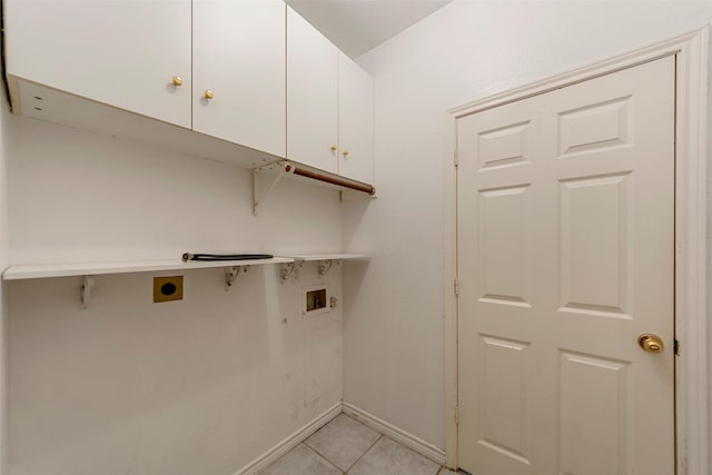 2806 Glenwick Ct, Richardson, TX 75082 - laundry area with hookup for an electric dryer, cabinet space, hookup for a washing machine, light tile patterned floors, and baseboards